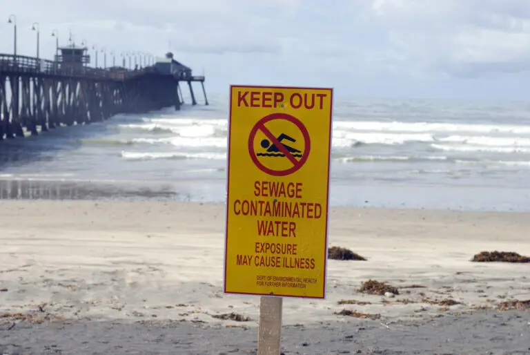 Envonmental sewage pollution warning on a beach