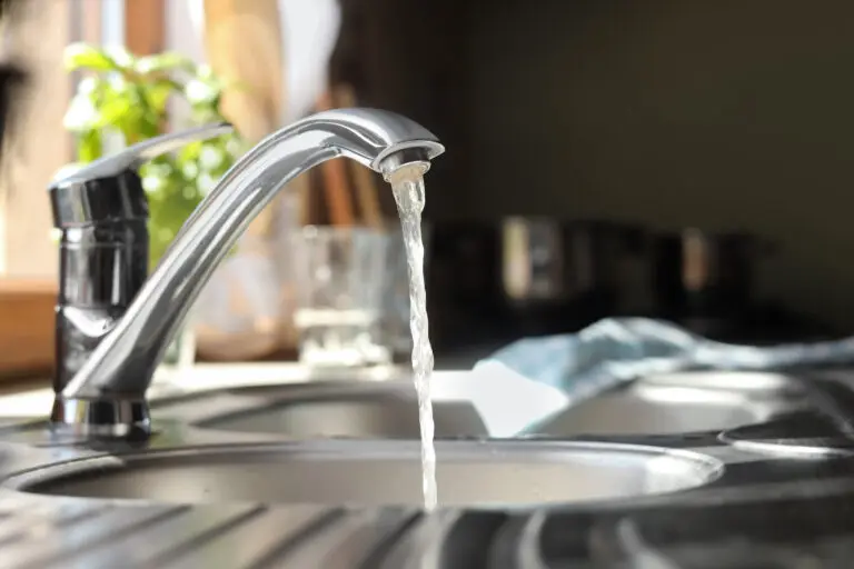 Water running slowly from a tap due to low water pressure