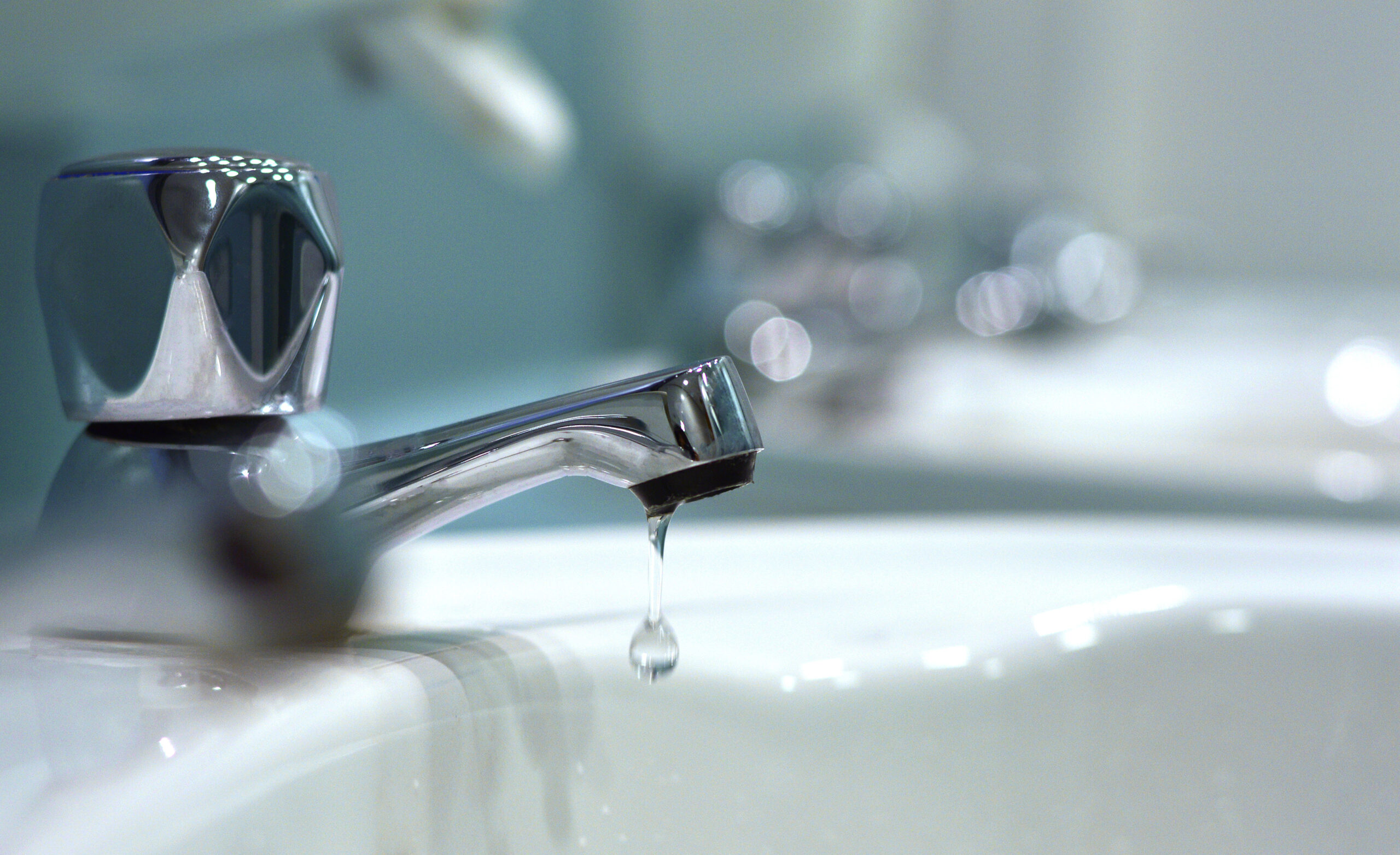 Close up of a dripping tap in water company fines for customer service update